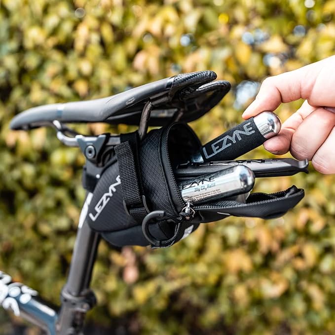 LEZYNE Caddy Bike Saddle Bag - Durable Nylon Cycling Storage Bag with Velcro/Quick Release Mount, Reflective Accents, Water-Resistant Zipper for Road Bikes & Commuters